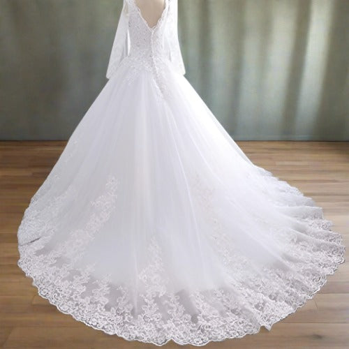 "Glamorous white satin net Christian train gown with a statement train."