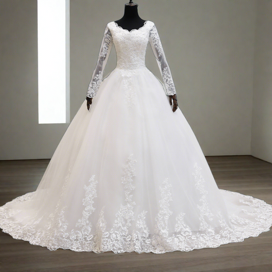 "Vintage-inspired Catholic lace patch pearl bridal gown with a cathedral train."