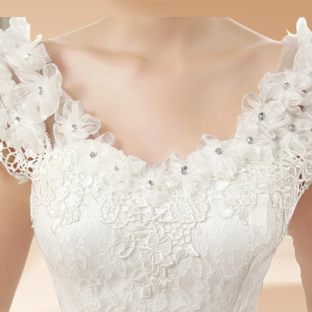 white bridal dress  neck with floral appliques.