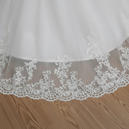 GownLink cathedral bridal gown with intricate lace embroidery and flowing train