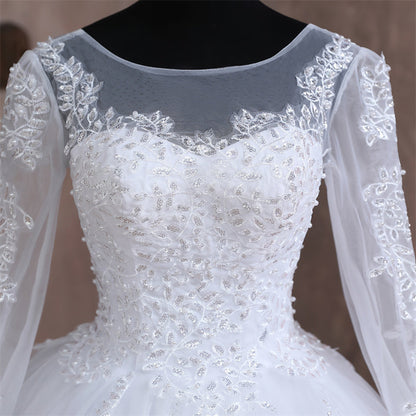Christian bridal gown with embroidered lace hem and elegant cathedral-style train