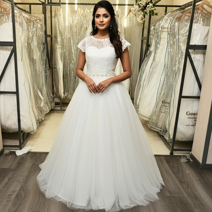 Front view of White Ball Gown on model against studio backdrop — GownLink GLHS587B