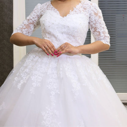 Lace appliqué tulle skirt detail on GownLink wedding gown