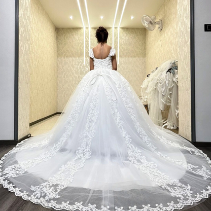 Lace cascade appliqué skirt detail on GownLink wedding gown