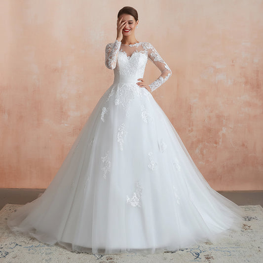 Elegant GownLink Christian wedding gown with long lace sleeves and a classic ball gown silhouette
