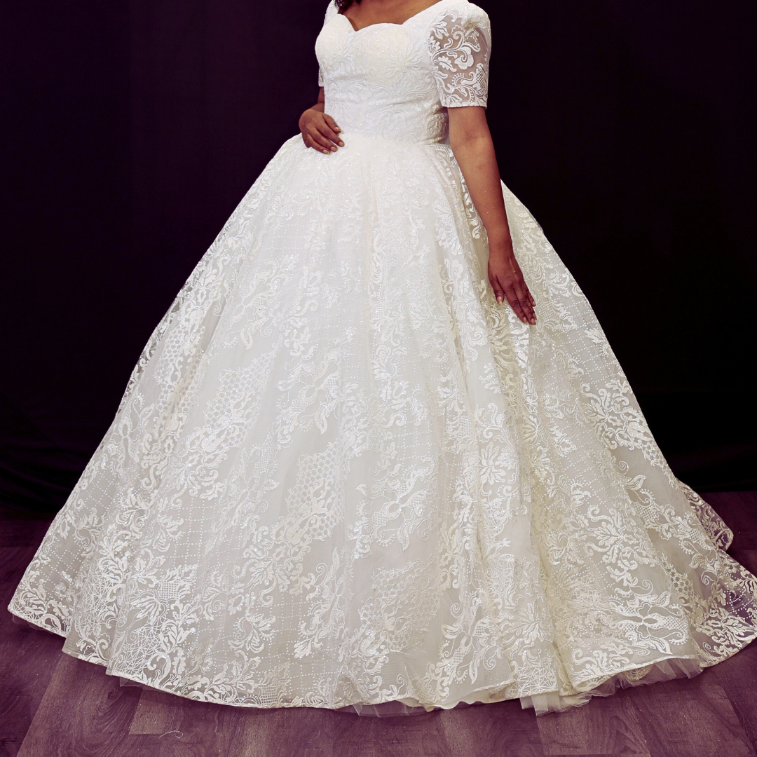 Front view of White Ball Gown on model against studio backdrop — GownLink GLGT166B