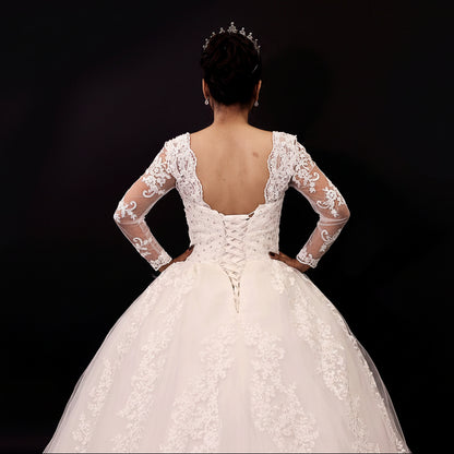 Designer white Christian wedding gown with lace train by GownLink