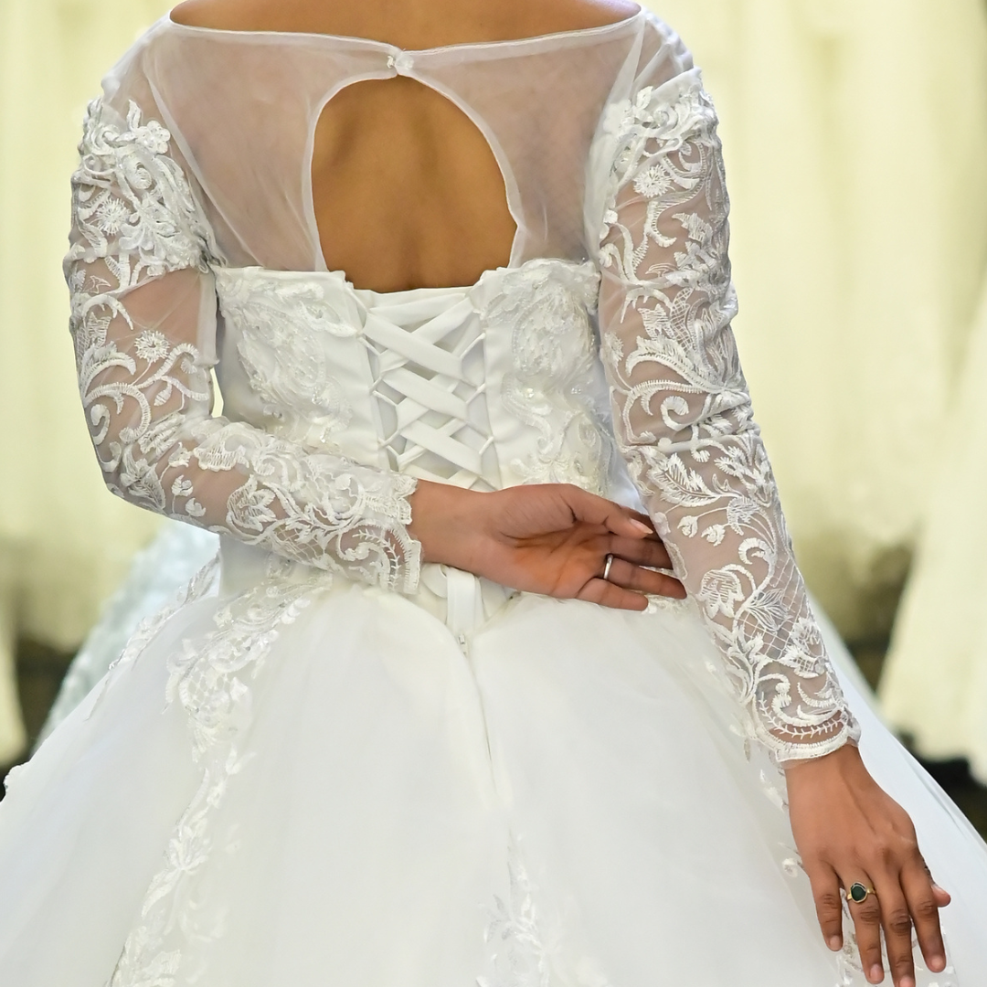 White lace church wedding ball gown with embroidered floral details and graceful silhouette