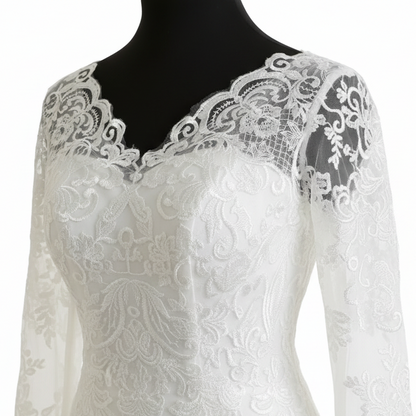 Classic Christian wedding gown featuring delicate lace details, long sleeves, and a full princess-style skirt