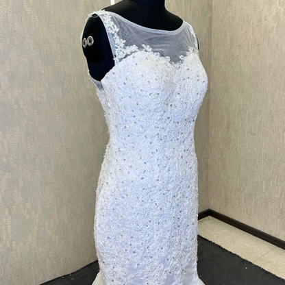 Classic Christian bridal gown featuring a lace bodice and elegant mermaid-style skirt