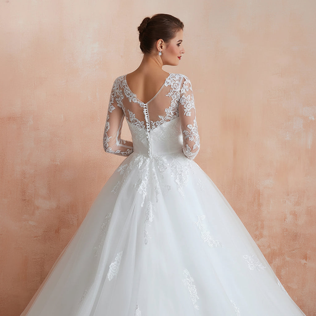 Classic white bridal gown with long sleeves and elegant cathedral-inspired train