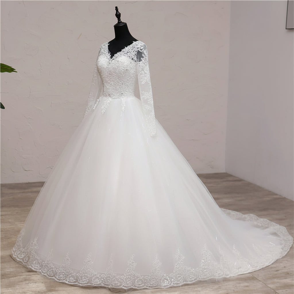 Classic white Christian wedding dress with long lace sleeves and embroidered lace hem