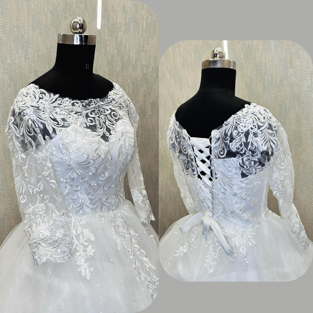 Designer Christian bridal gown with long sleeves, lace detailing, and elegant ball gown silhouette