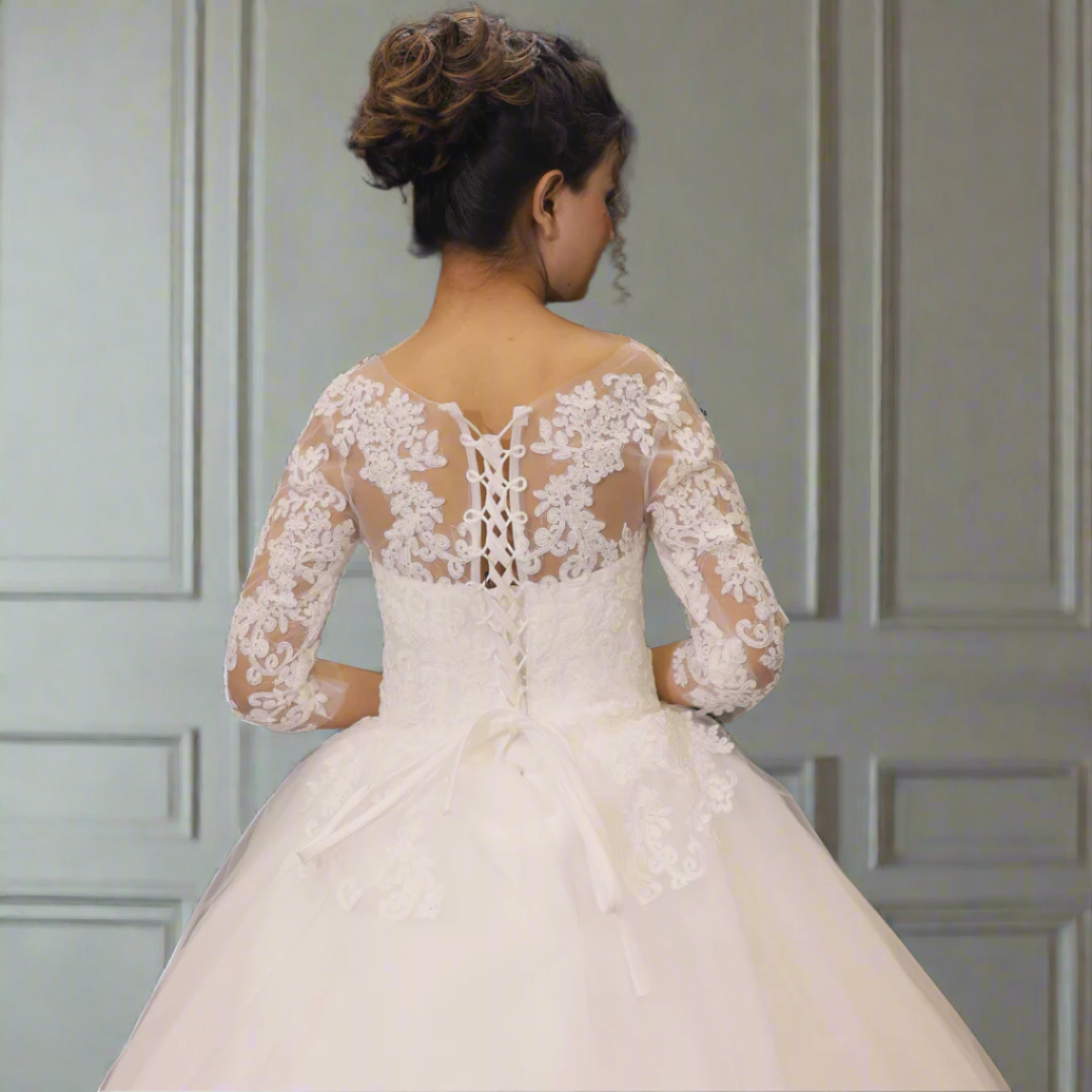 Designer Christian bridal gown with lace off-shoulder neckline and elegant ball gown silhouette