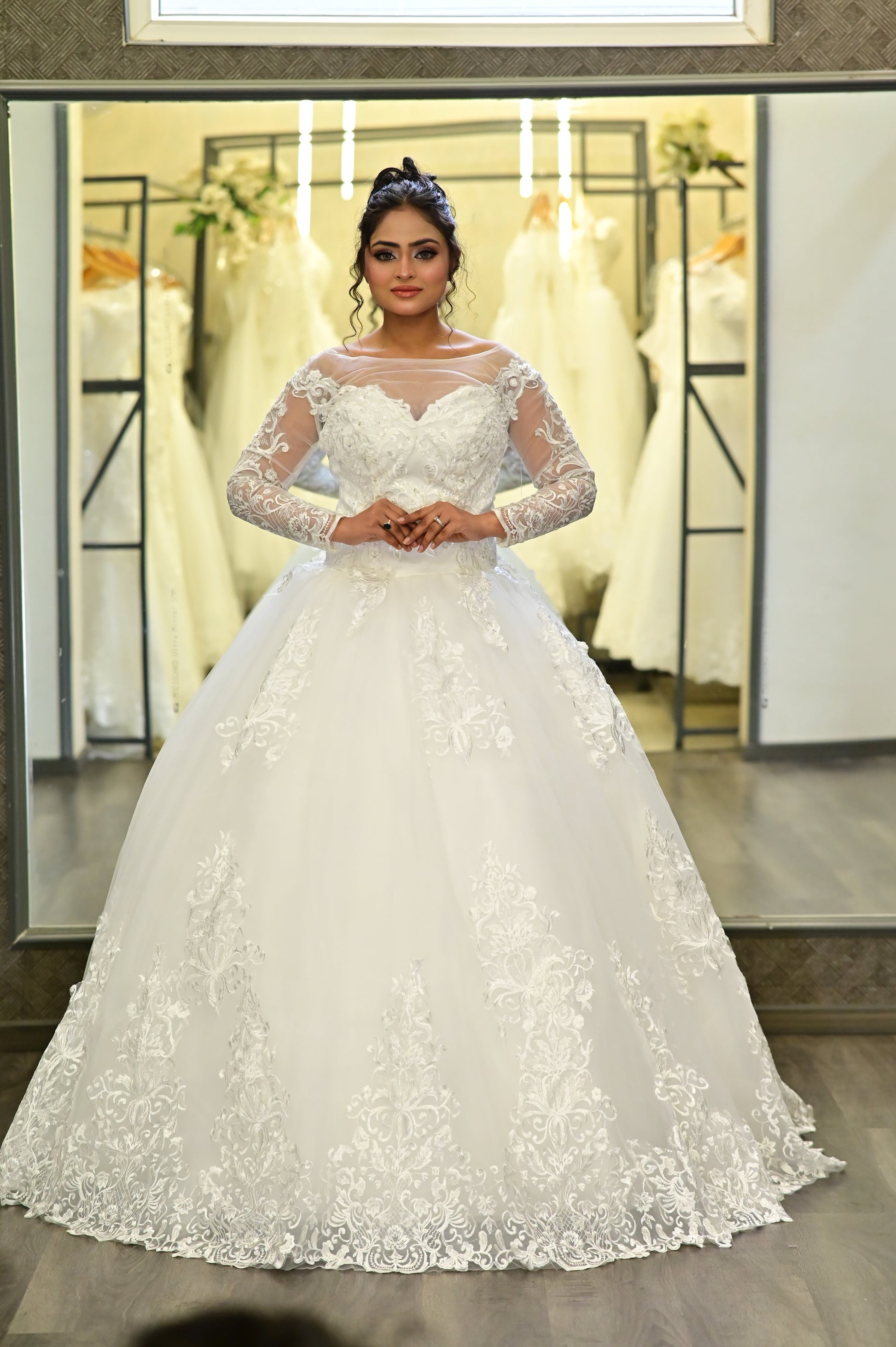 Elegant full-length Christian bridal ball gown with intricate lace appliqué