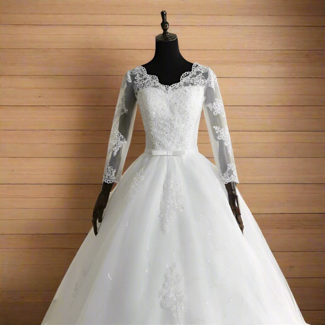 Elegant Christian wedding dress with cathedral-length train and floral lace accents