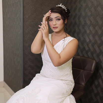 Elegant Christian bridal gown with a V-neck bodice and flowing tulle train