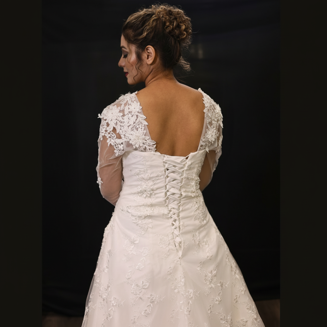 Elegant church ceremony wedding gown with floral lace sleeves and a graceful bridal silhouette