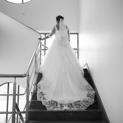 Elegant Christian bridal ball gown with illusion lace neckline and embroidered bodice