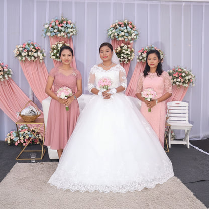 Elegant princess Christian bridal gown with sheer lace sleeves and full tulle skirt
