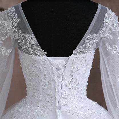 Elegant princess-style Christian wedding gown with detailed lace bodice and layered skirt