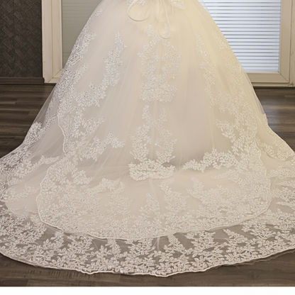 Elegant white wedding gown by GownLink with luxurious lace detailing and a classic Christian bridal design