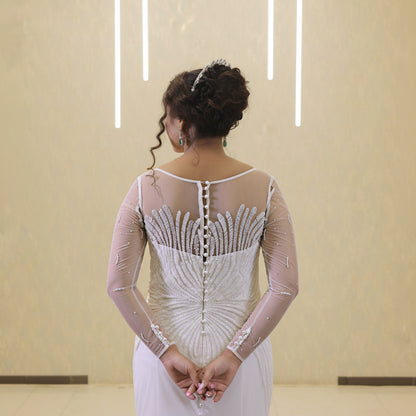 Elegant white Christian wedding gown with flowing train for a sophisticated bridal appearance