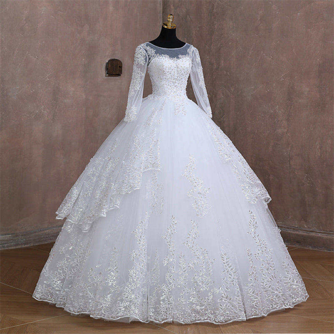 Embroidered Christian wedding ball gown with luxurious lace appliqués and classic bridal design