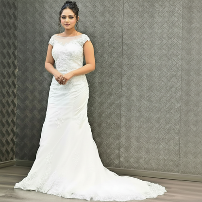 Embroidered Christian wedding gown with sparkling floral lace and an elegant fitted bodice