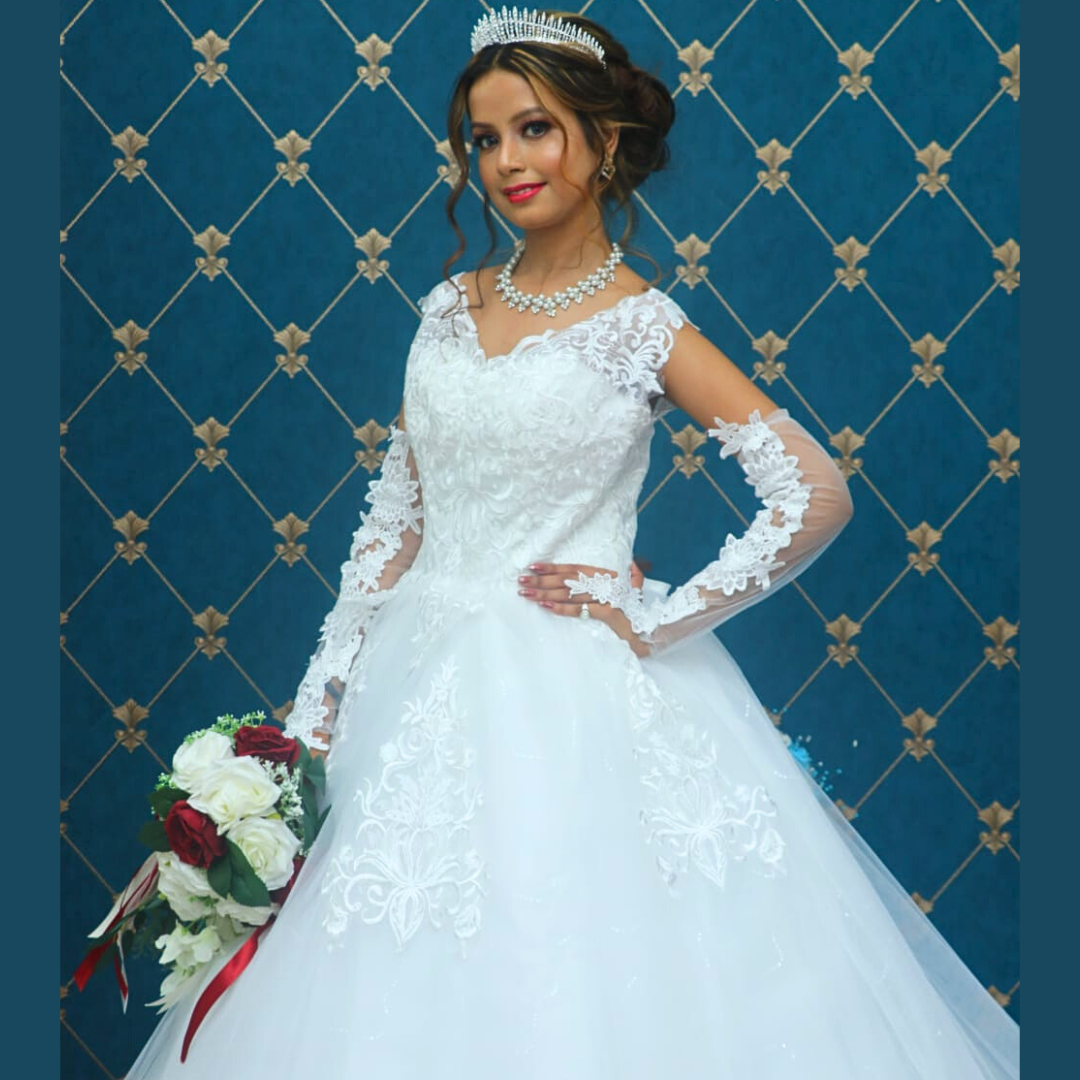 Embroidered white Christian bridal dress with lace bodice, full skirt, and timeless wedding style