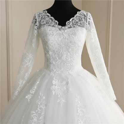 European-style Christian wedding gown featuring elegant lace sleeves, fitted bodice, and flowing bridal train
