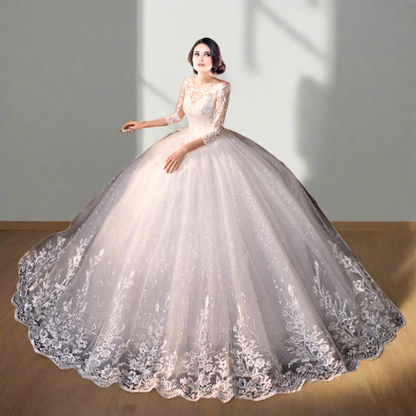 Fairytale-inspired Christian wedding dress with embroidered lace sleeves and flowing tulle skirt