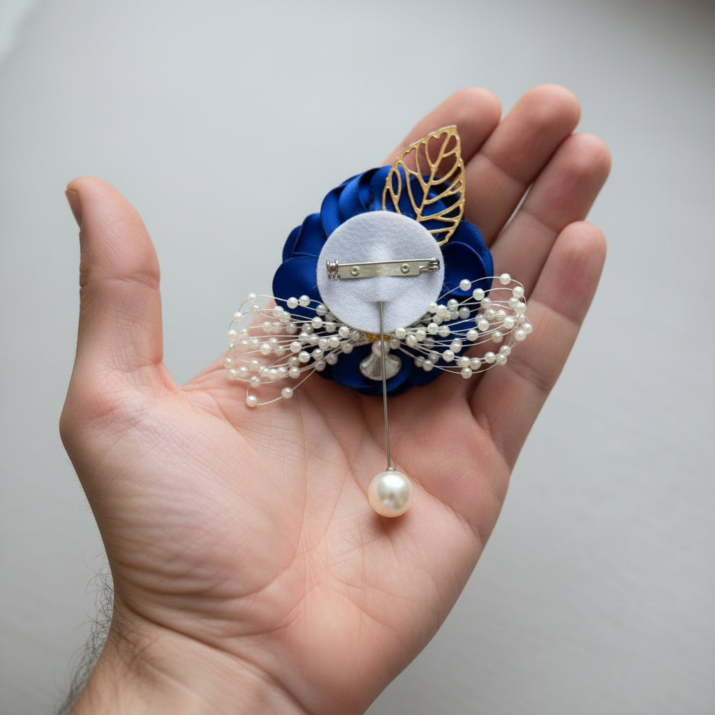 Close-up of flower and leaf detail on Groom Boutonniere — GownLink CFM1