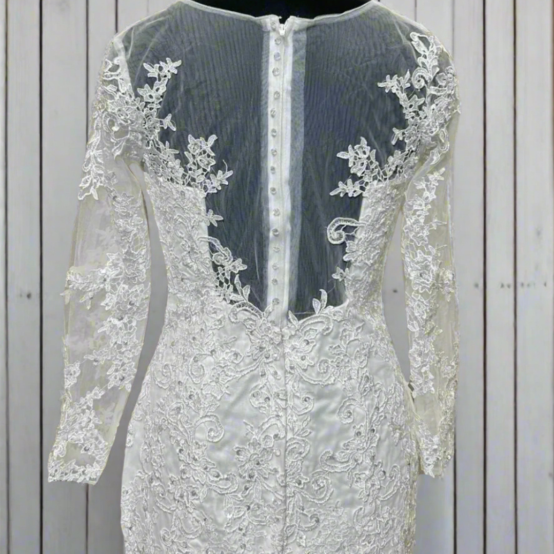 Christian mermaid bridal dress featuring an illusion neckline, lace embroidery, and a timeless white finish

