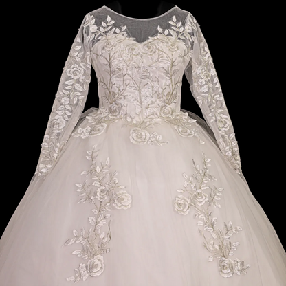 Christian wedding gown with illusion neckline, embroidered lace bodice, and luxurious princess silhouette