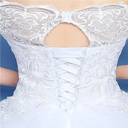 Detail of neckline and bodice on White Princess with Off Shoulder — GownLink GLQD09