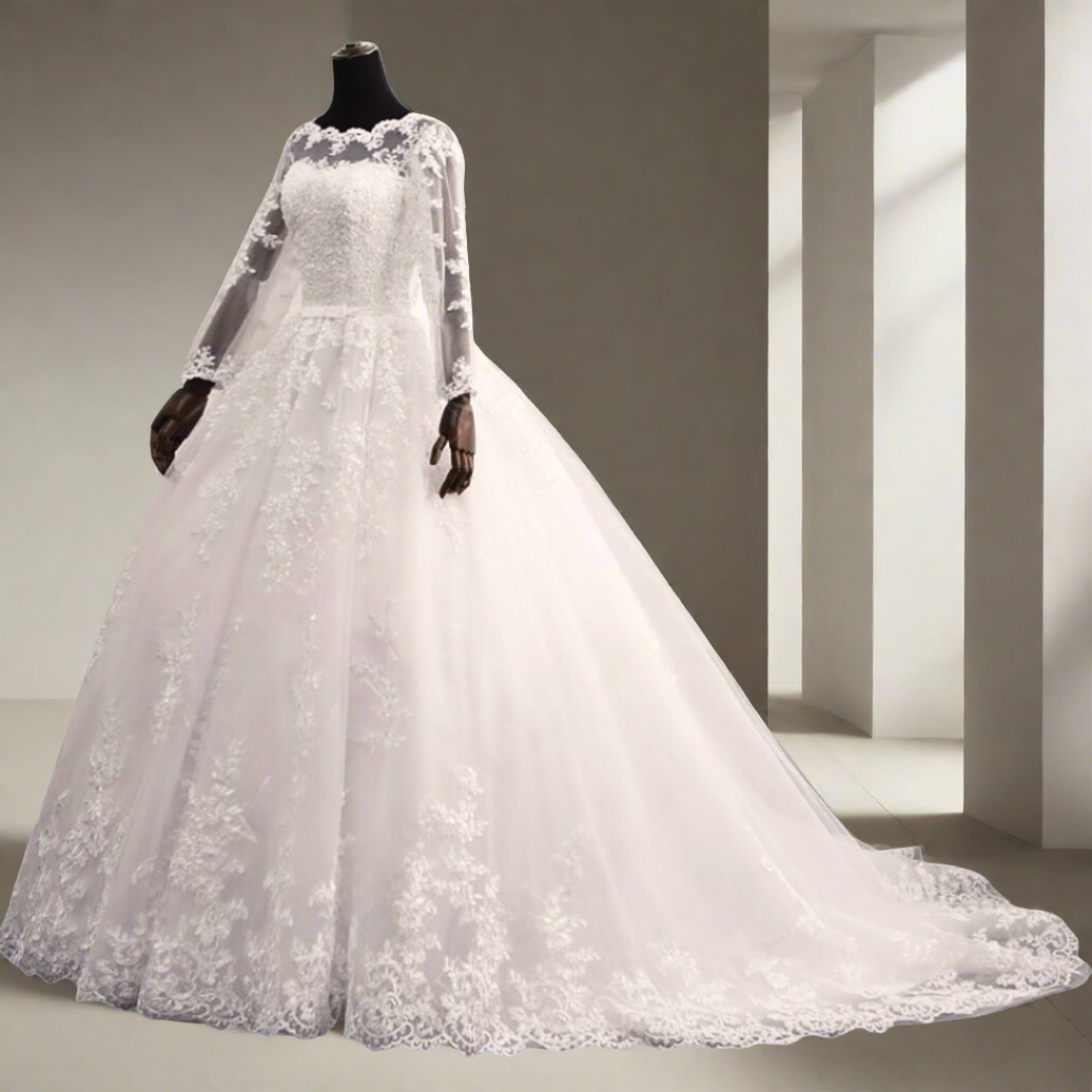 White lace Christian bridal gown featuring sheer long sleeves and a full princess skirt