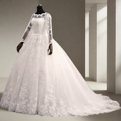 White lace Christian bridal gown featuring sheer long sleeves and a full princess skirt