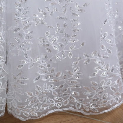 Layered Christian ball gown with floral lace appliqués and elegant cathedral-inspired design