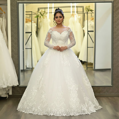 Long sleeve lace wedding dress for Christian brides with timeless princess styling