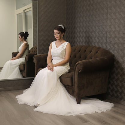 Christian wedding dress with sheer long sleeves and a modern mermaid silhouette