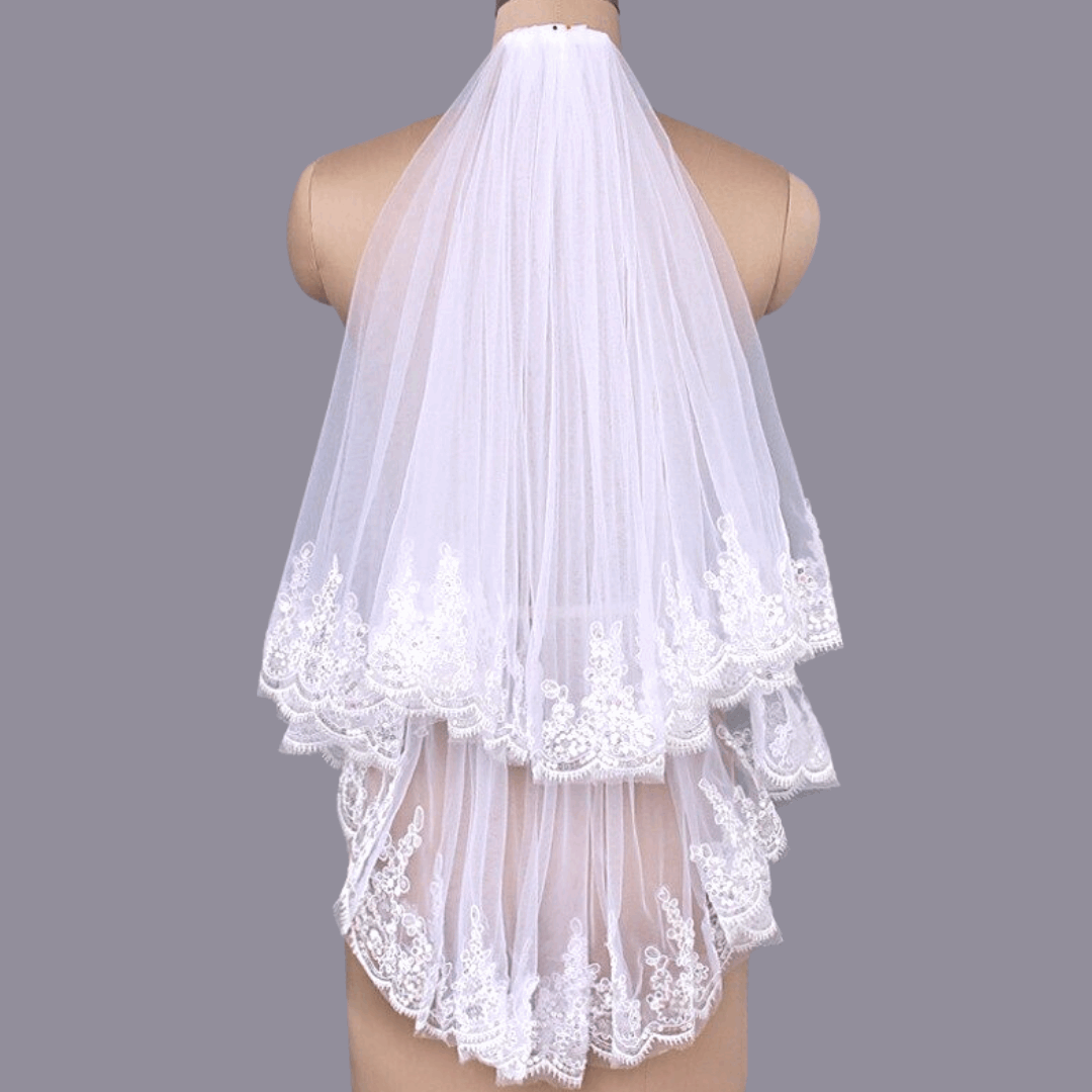 Long white bridal veil with lace trim and face blusher