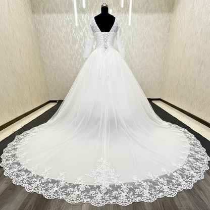 Luxury Christian bridal gown with sparkling lace details, voluminous tulle skirt, and long train