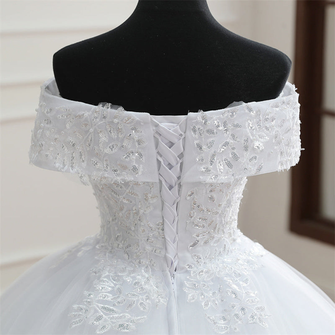 Luxury Christian princess wedding gown with delicate lace patterns and voluminous tulle skirt