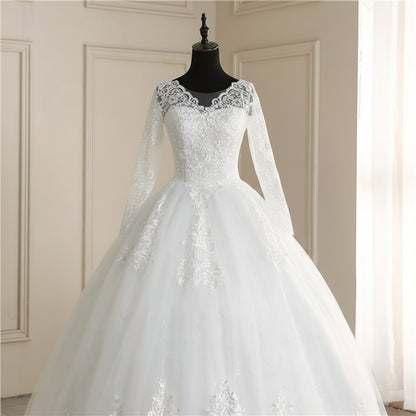 Modest white Christian wedding dress featuring long lace sleeves and a sophisticated bridal silhouette