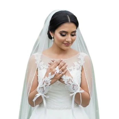 Pair of Pearl Bridal Gloves laid flat — GownLink G21