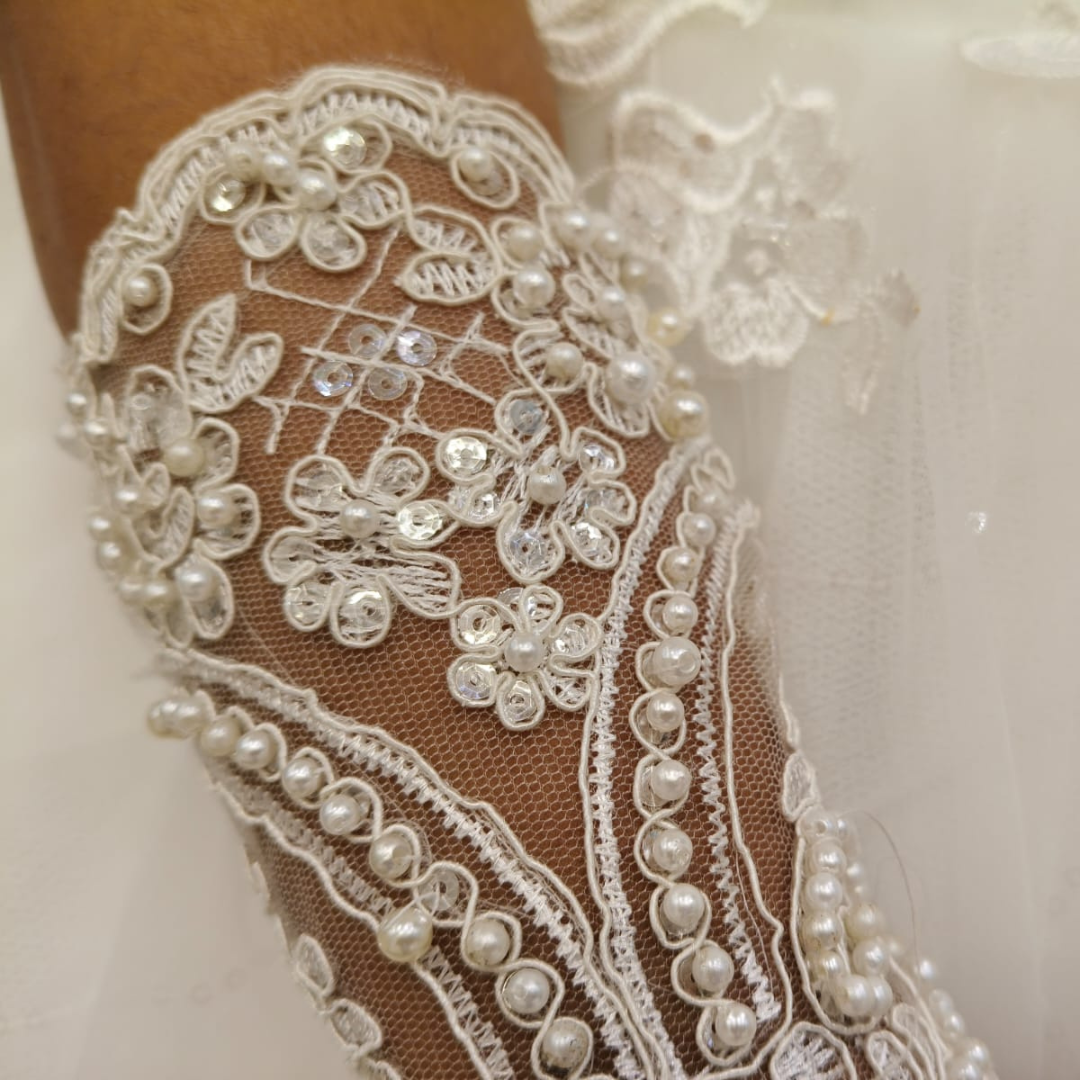 Model wearing Pearl Bridal Gloves with bridal gown — GownLink G2