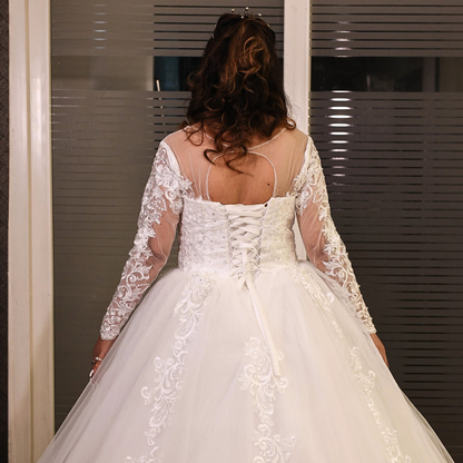 Premium Christian princess wedding gown with embroidered lace, full tulle skirt, and sophisticated bridal style