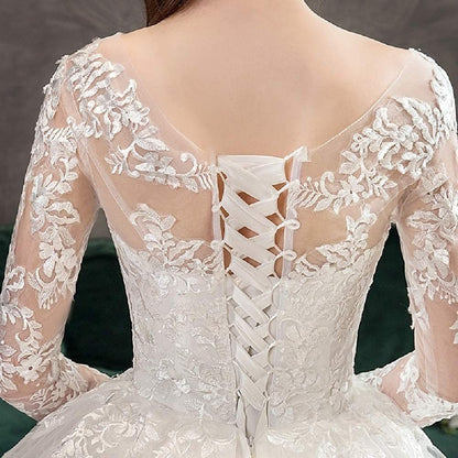 Princess-style Christian wedding gown featuring a fitted lace bodice and flowing tulle skirt