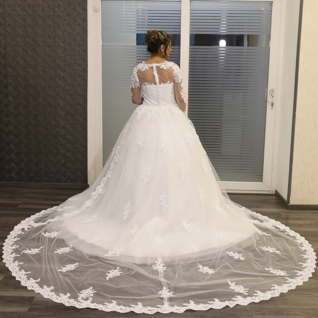 Princess-style Christian bridal gown with embroidered lace appliqués and long sleeves